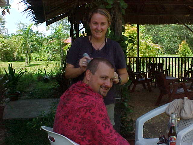 MVC-002S-Haircut!. SaraGrace Keenan "SGK", and Michael Alessio. Sepilok Orangutan Rehabilitation Centre, Sabah, Malaysia: I went completly clean on this one. (The Travel Addicts, Malaysia)