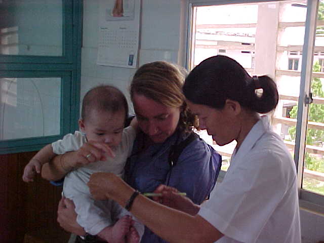 The Vietnamese woman in the last photo is Sister Danielle - she has been with the orphanage since the early 70's and probably changed Kevin's diaper when he was here. (Vietnam, The Travel Addicts)