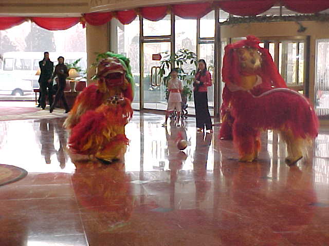 MVC-181S. , Beijing, Beijing Shi, China (北京, 北京市, 中国): These dancers were in the lobby of a big tourist hotel around the corner from our budget backpacker hotel.  We would go into the big hotels in order to get a taxi,, or other service.  Everyone just assumed that we were staying there since we were obviously "foreign devils" (The Travel Addicts, China)