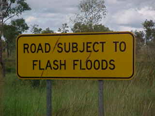 Sign says: Road subject to flash floods