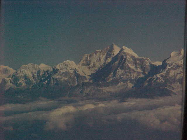 Last view of the Himalayas on our flight out (India, The Travel Addicts)