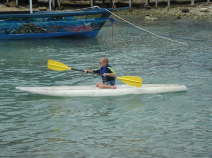 Paddling the board